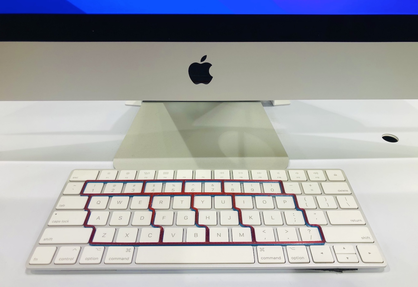 Red Blue stencil on the Magic Apple MAC keyboard in Costco ViaTyping